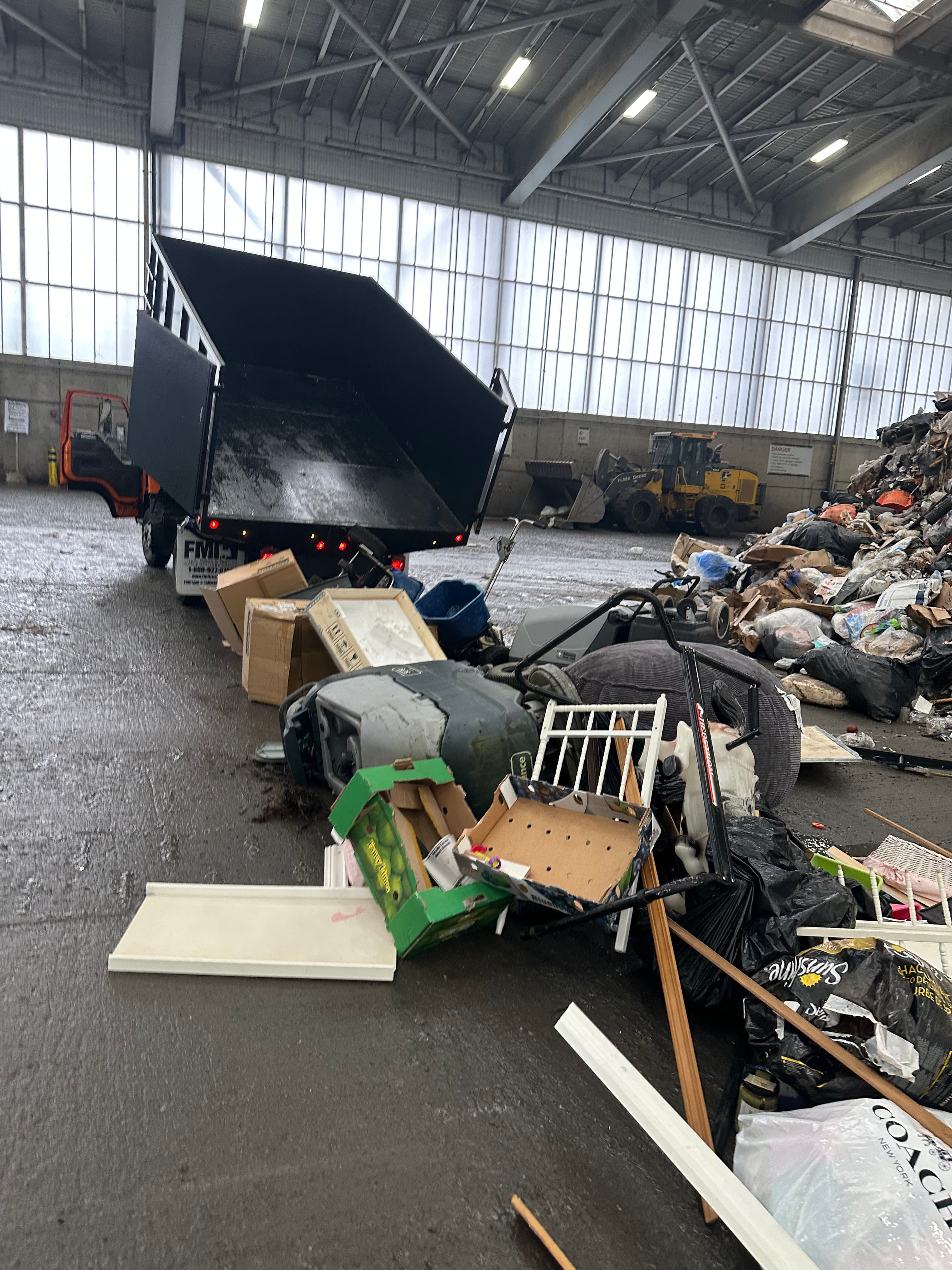 truck filled with junk at a landfill